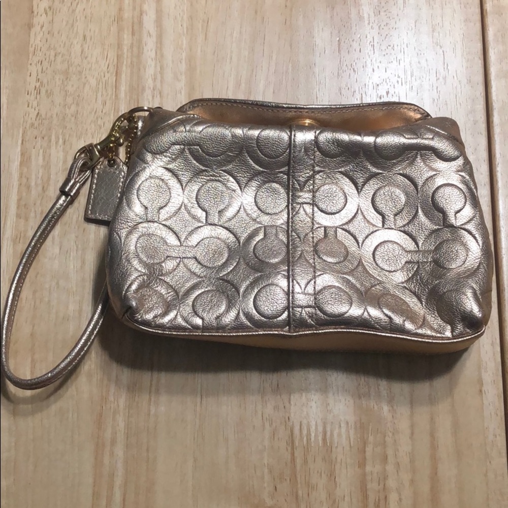 Rose gold coach clutch!